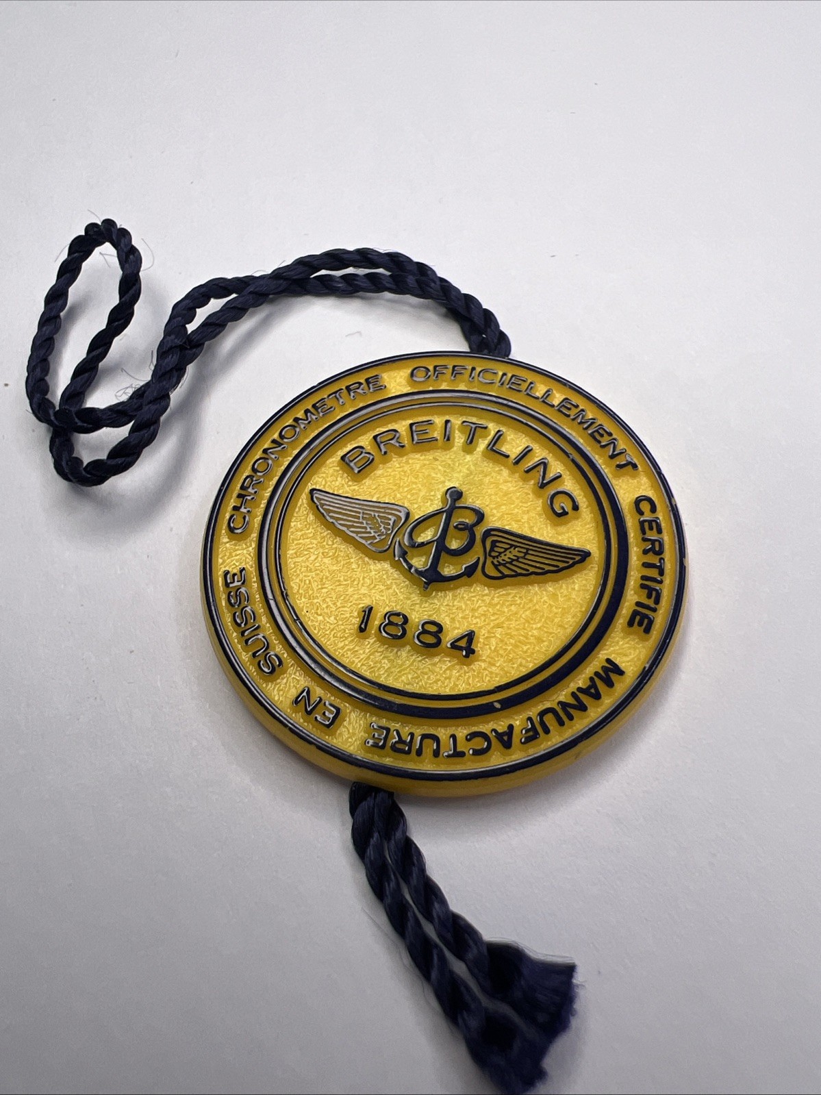 Breitling 1884 Yellow Plastic Hang Tag With Blue Writing & Rope OEM
