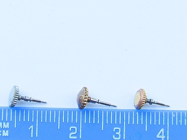 Three vintage Rolex Brevet + watch crowns and stems. Parts