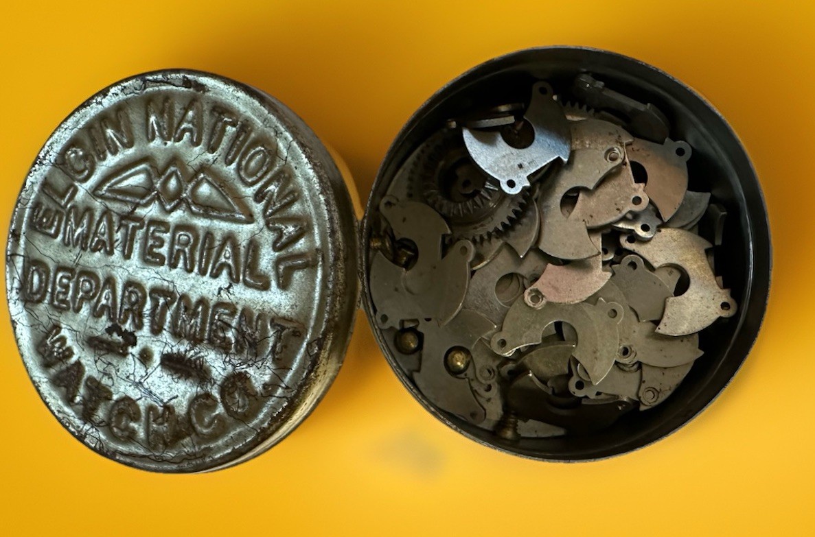 Vintage Elgin National Watch Co. Material Dept. Tin w/ Assorted Watch Parts Lot