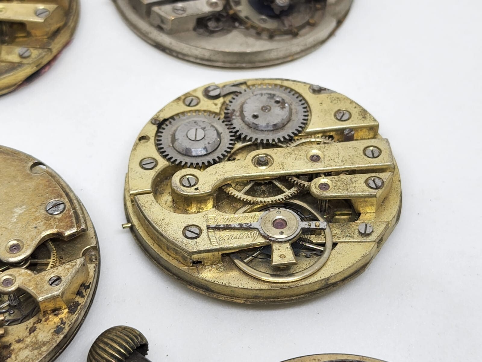 Lot of 6 high end pocket watch movements – Sold for parts – AS IS