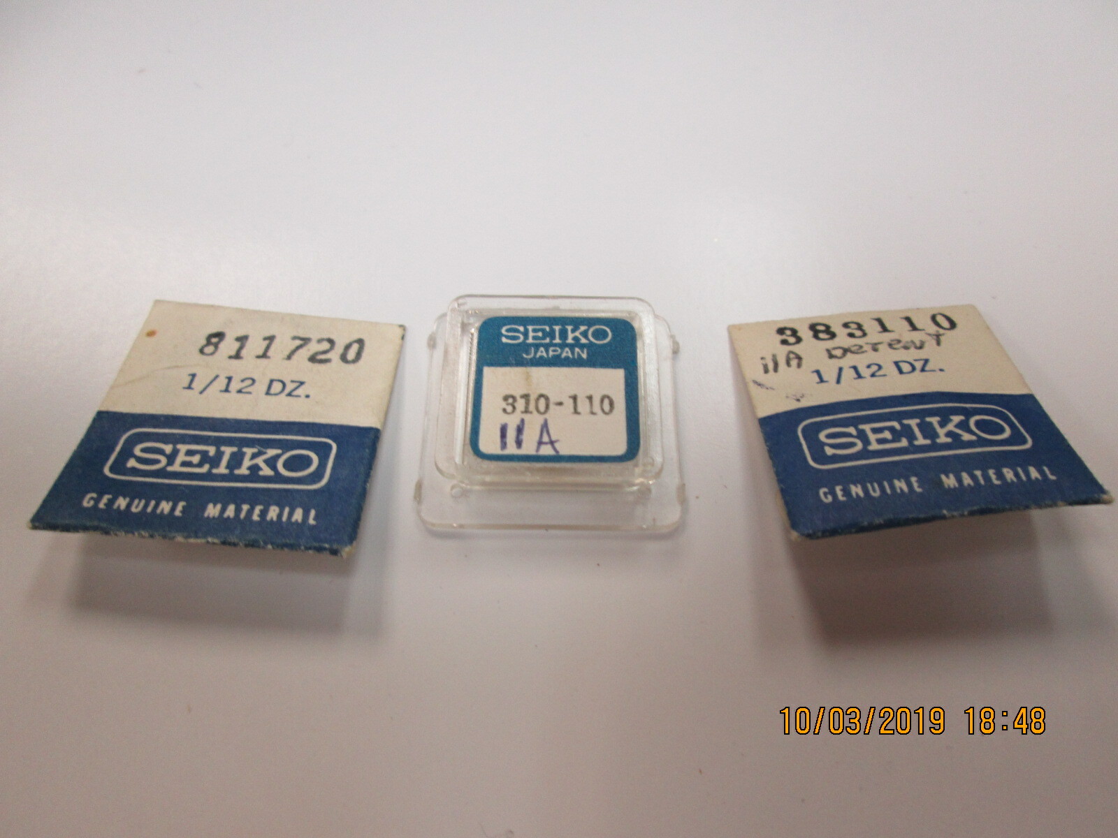 NOS SEIKO WATCH PARTS 8 PIECES STEMS, GASKETS, 1 BALANCE WHEEL AND HAIRSPRING