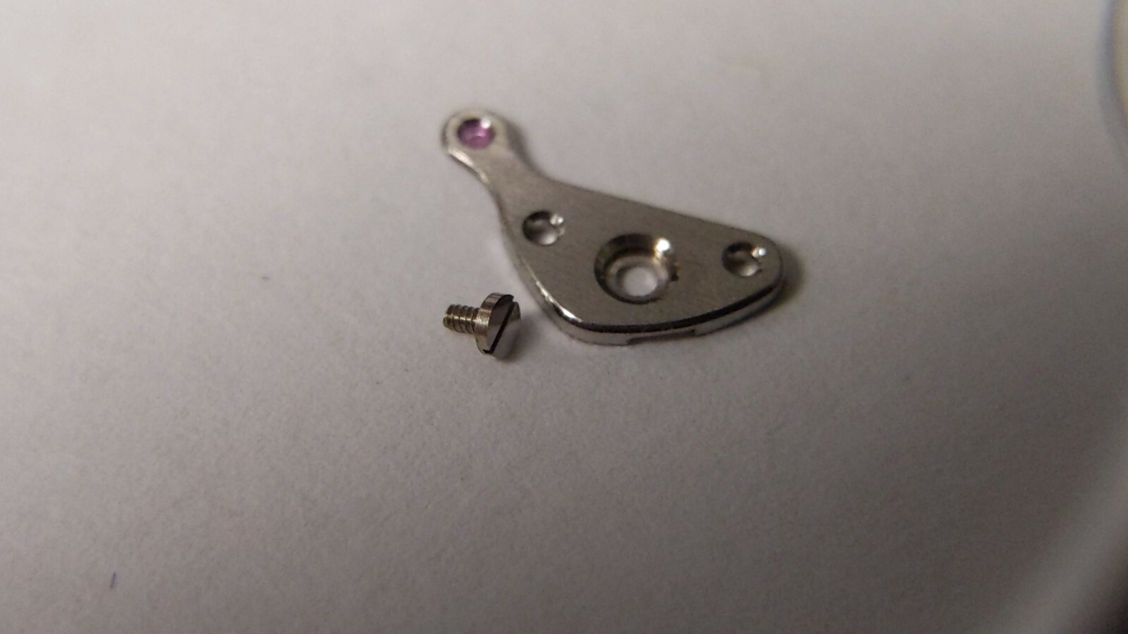 Lecoultre K866 BRIDGE part, small AND 1 SCREW great condition, pre-o. PART NAME