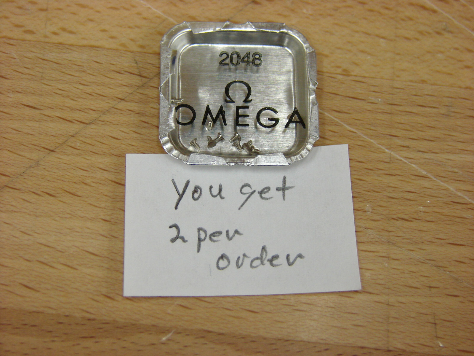 Omega wristwatch screws many to choose from arranged by Omega part number NOS!!!
