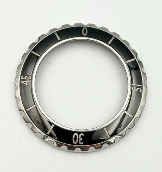 A Chanel J12 Black Ceramic Wristwatch Bezel for midsize model.
