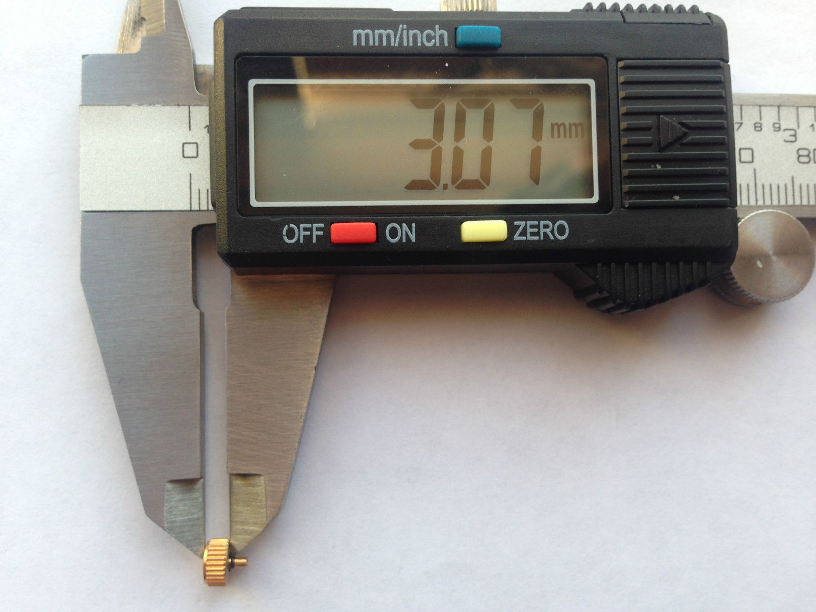 LONGINES YELLOW GOLD PLATED WATCH CROWN KEY (5.53mm x 3.07mm). (L-12)