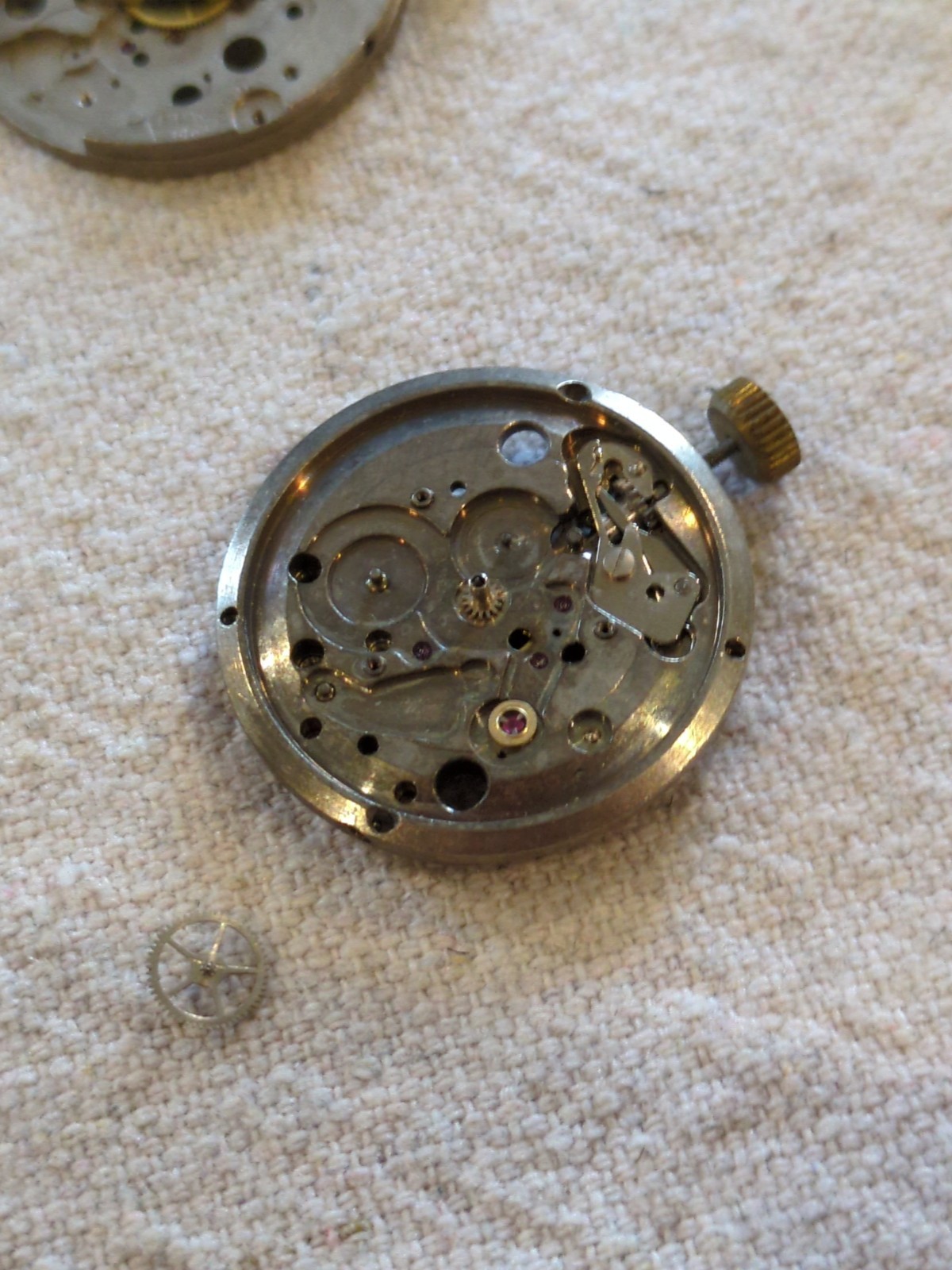 !Lot of 2 watch movements with a Box, Wheels, Plates, Screws, Springs, and more!