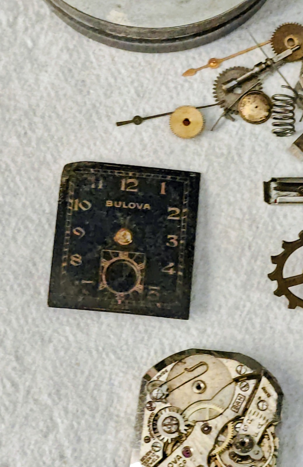Vintage Watch Parts Including Bulova In A Small Metal Tin Can Approx 13 X 38mm