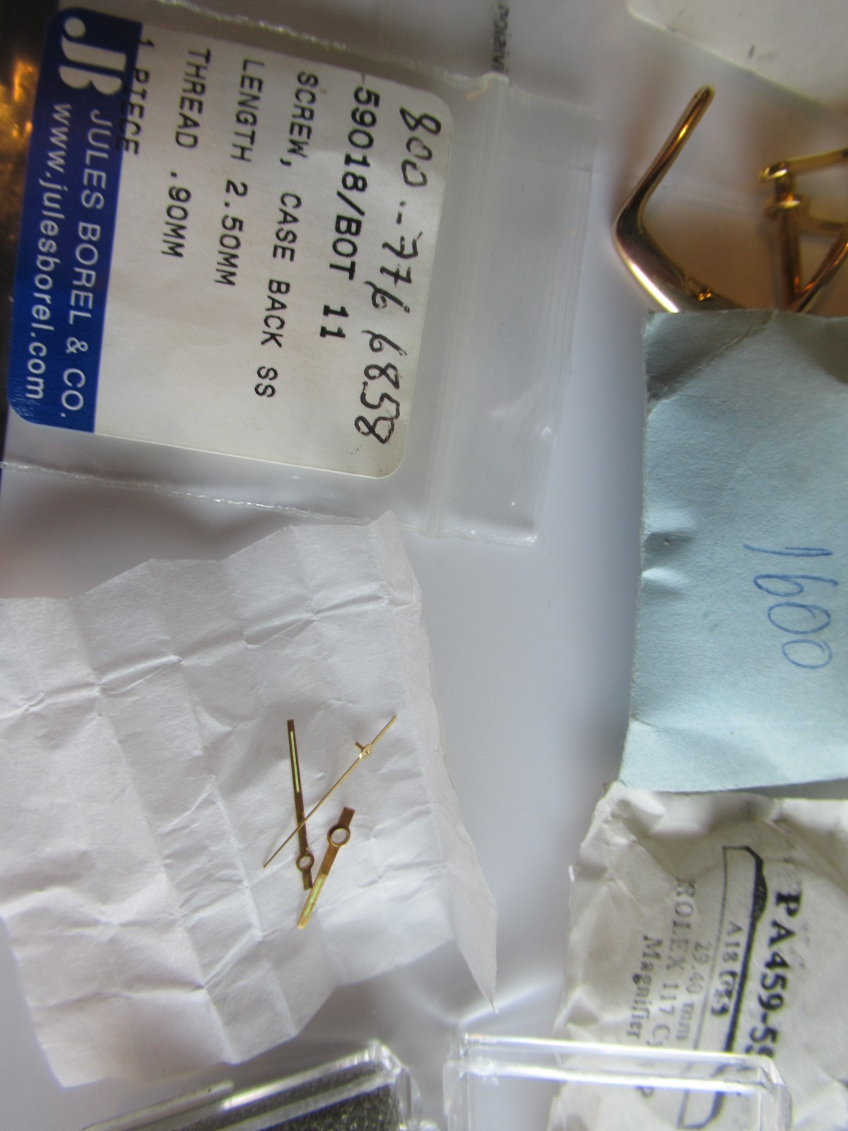 Rolex crystal gaskets hands tin box Various Misc Parts & Brands Lot sold As Is