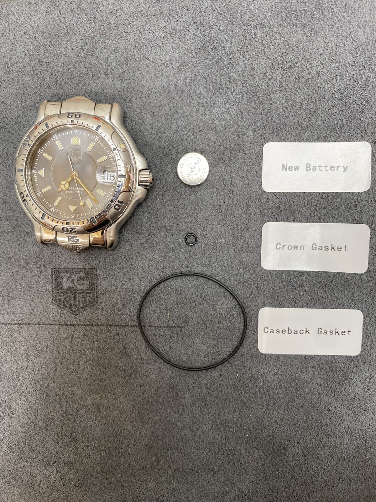 Service Package – Mens Tag Heuer 6000 Series (Crown & Back Gasket Set + Battery)