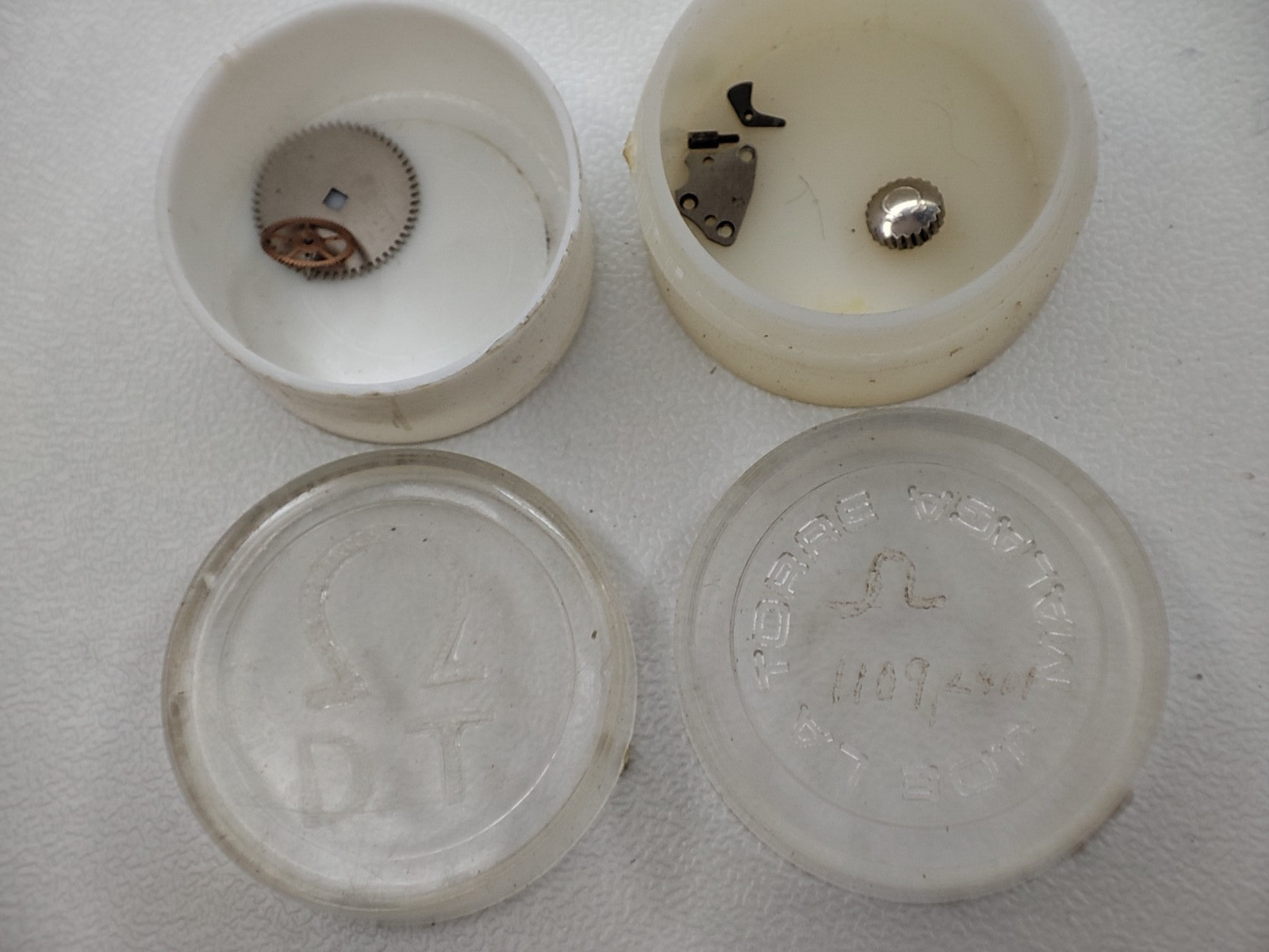 Mix watch parts OMEGA 1109 / 2401 OMEGA D.T. watchmaker crown and others