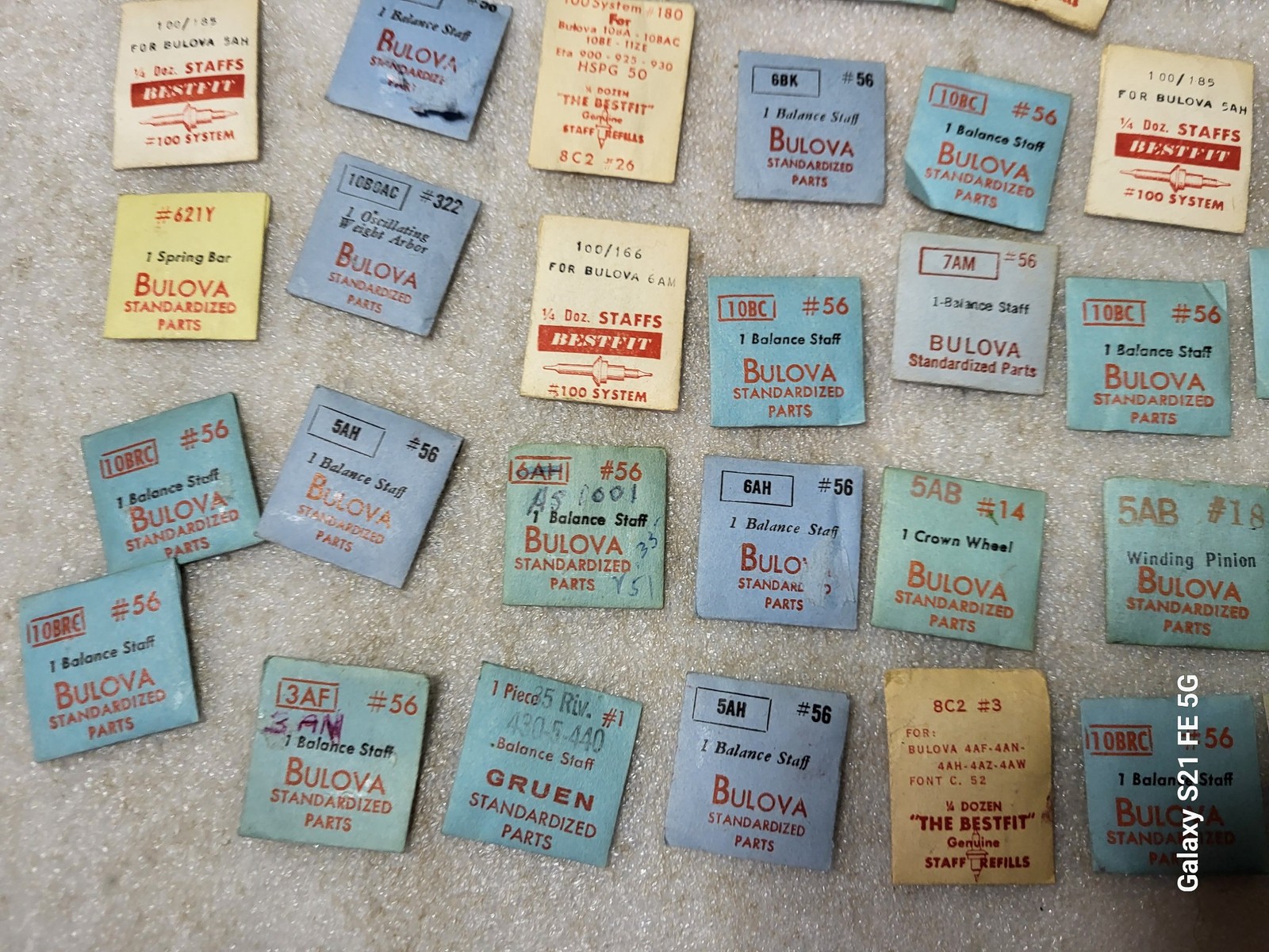 Lot of 58 Packages of Bulova Crown Staff & Balance Wheel Watch Repair Parts