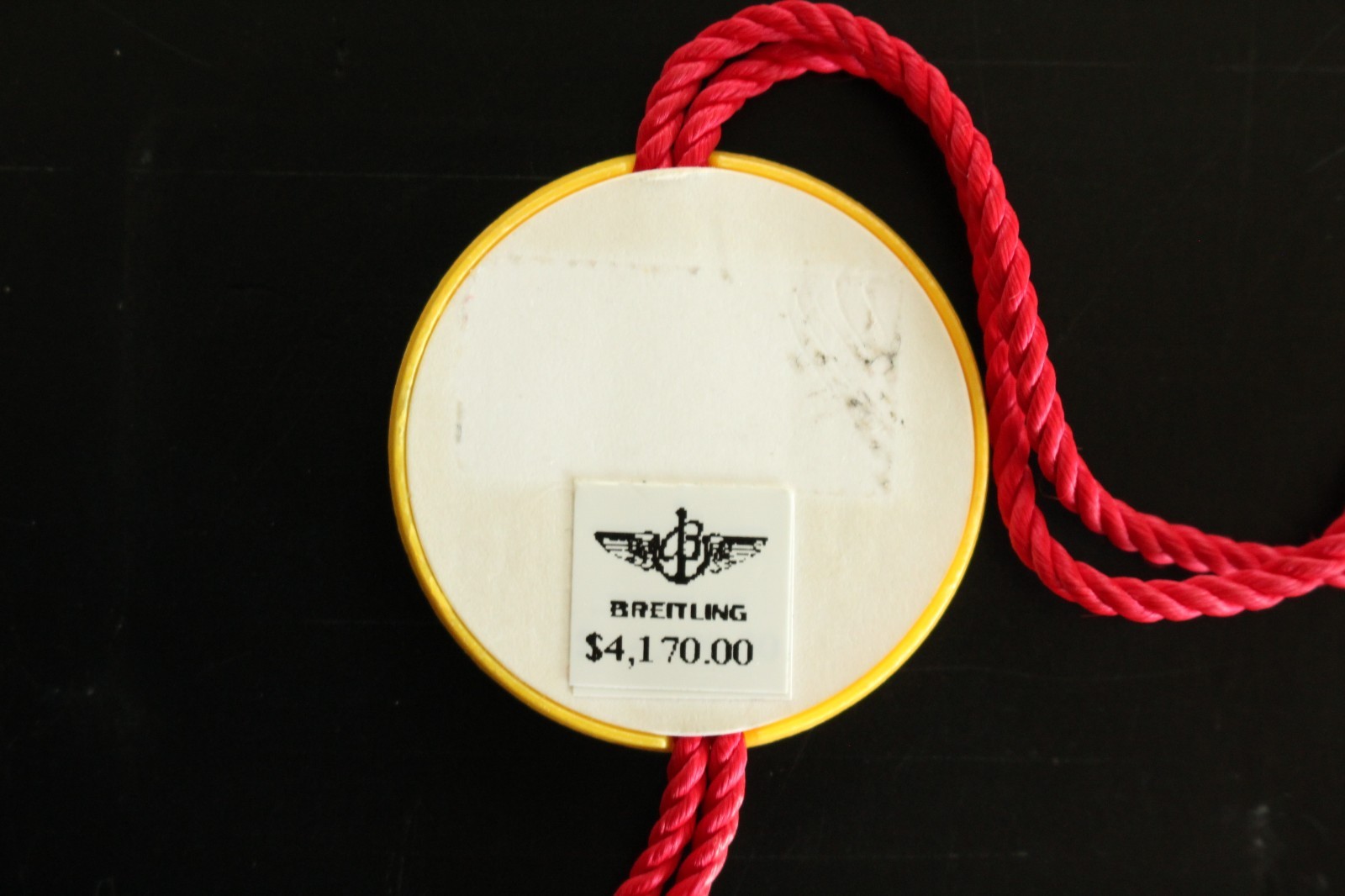 BREITLING FACTORY JEWELERS SALES ACCESSORY YELLOW PLASTIC WATCH HANG – SWING TAG