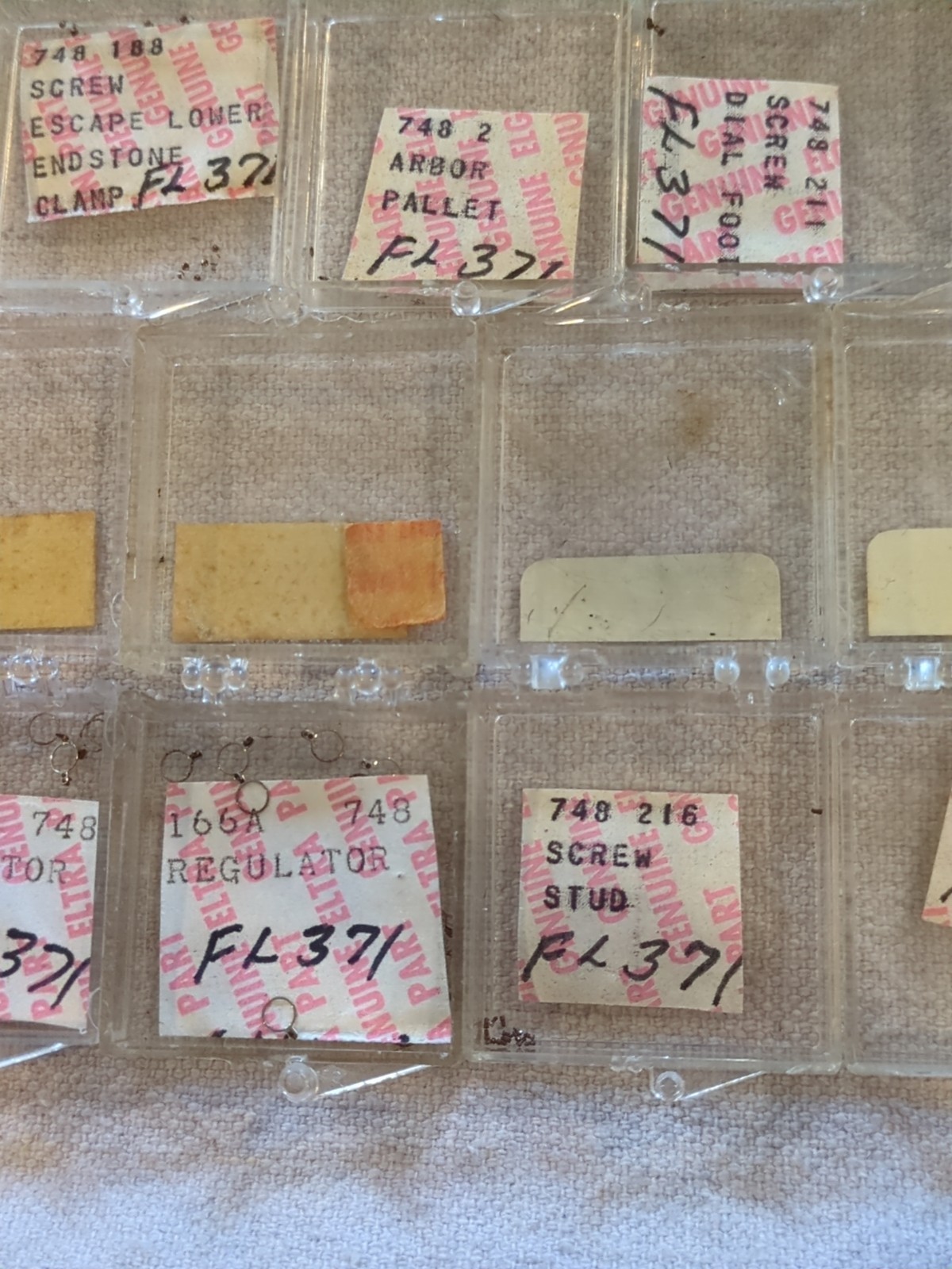 17 Boxes of Elgin 748 Movement Unused Jewels, Screws, Wheels, Regulators Etc…!