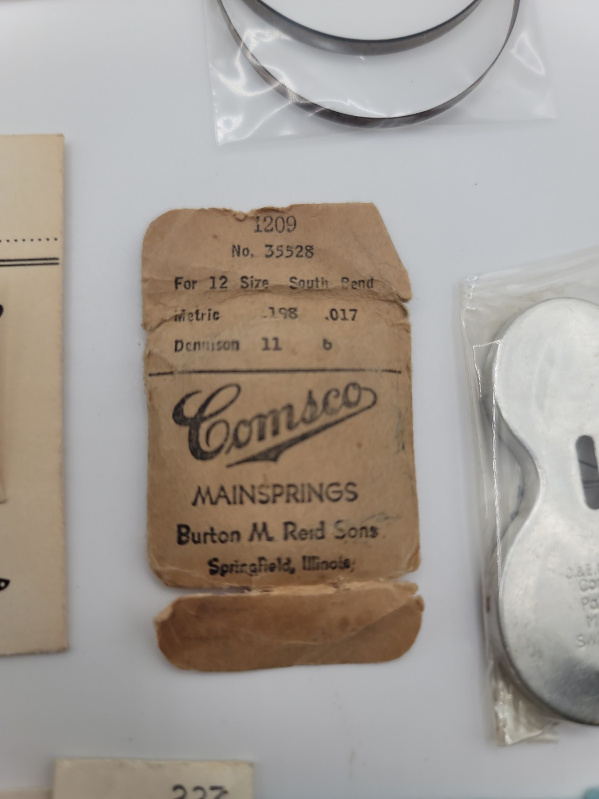 Lot of 12 Vintage Mainsprings, Crystals, Dials And More. Elgin Benrus Bulova