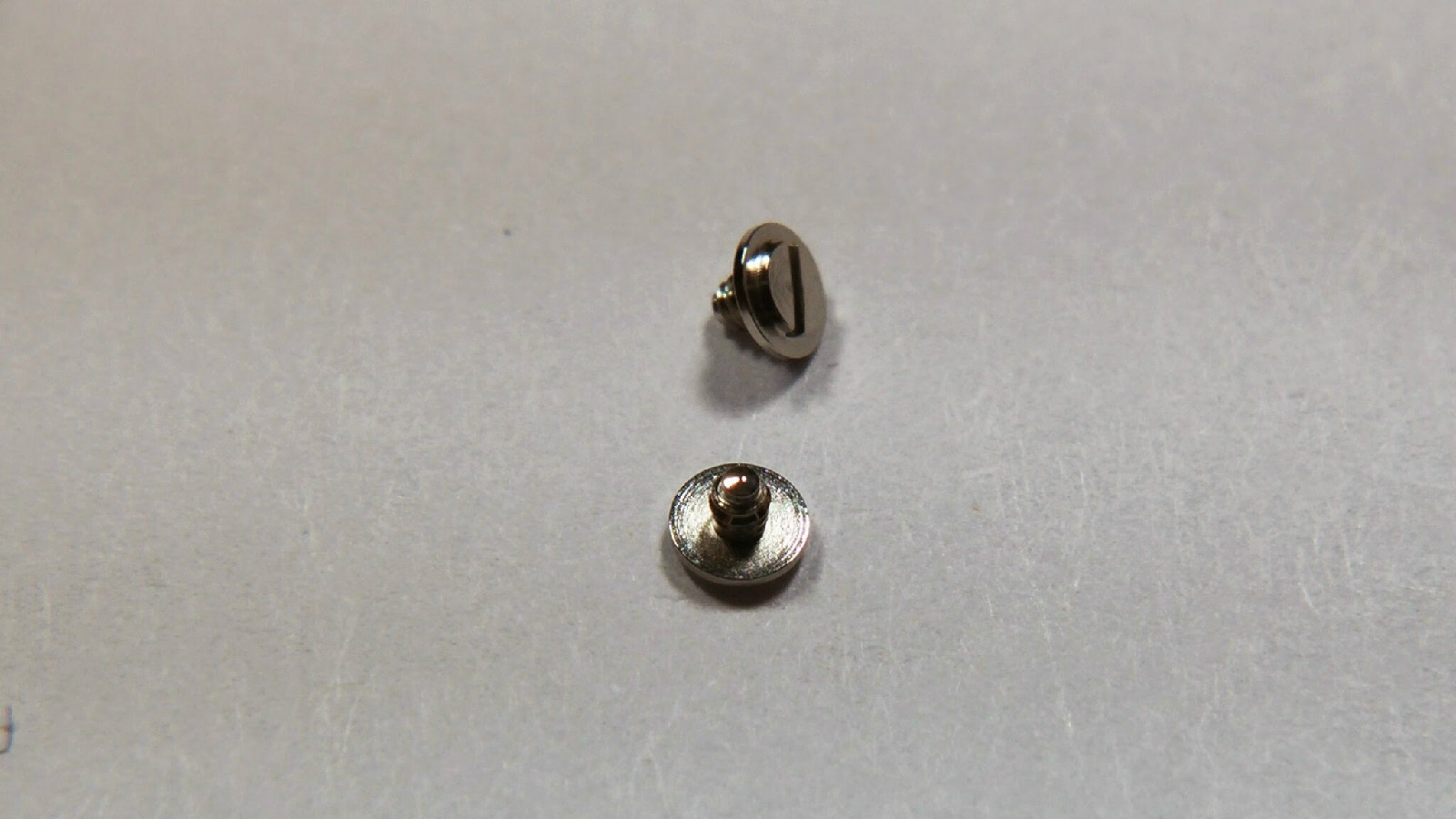 Rolex 1530 7897 case screws, head flat SEALED with 5 inside. Genuine NEW