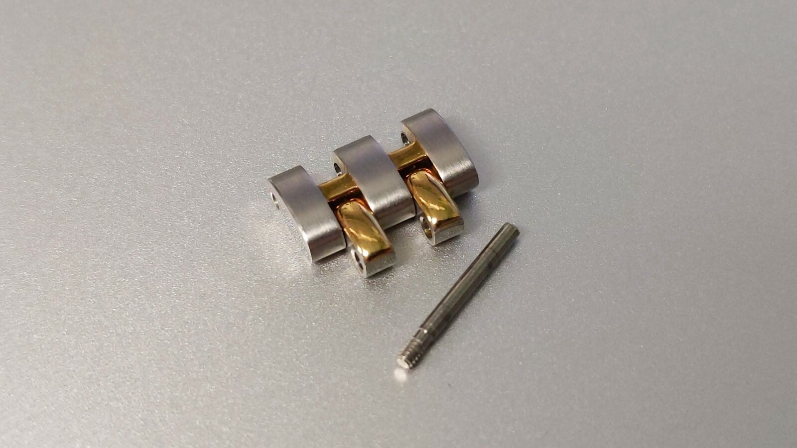 OMEGA LINKS S/S and Yellow 12mm x 6.9mm great condition. for watch repair