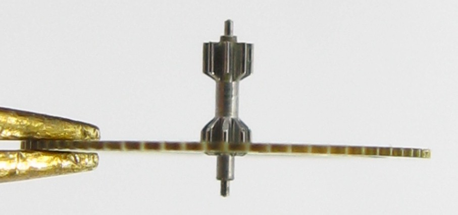 Seiko 6106 A 25 jewels watch part: intermediate wheel driving the second wheel