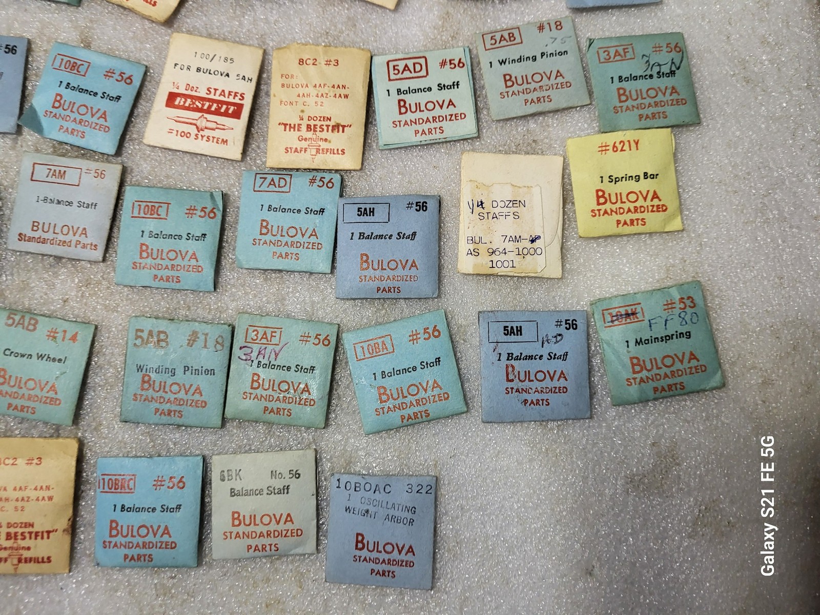Lot of 58 Packages of Bulova Crown Staff & Balance Wheel Watch Repair Parts