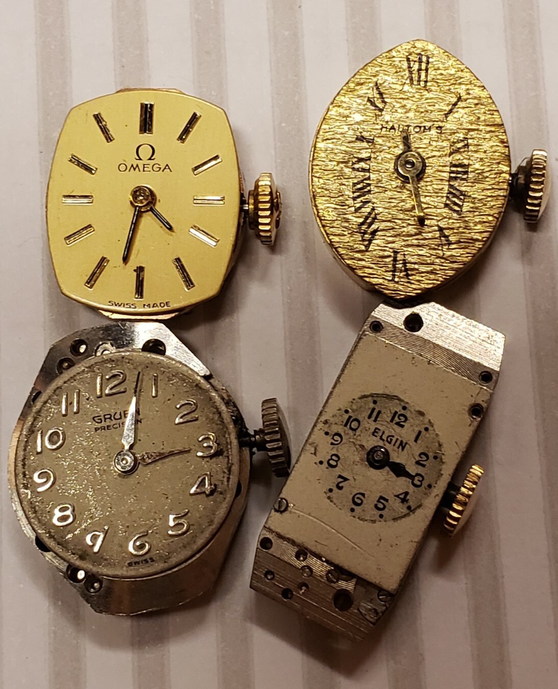 LOT OF 4 VINTAGE WIND-UP WATCHES FOR PARTS OMEGS, ELGIN, GRUEN, HALTOM’S, Belvil