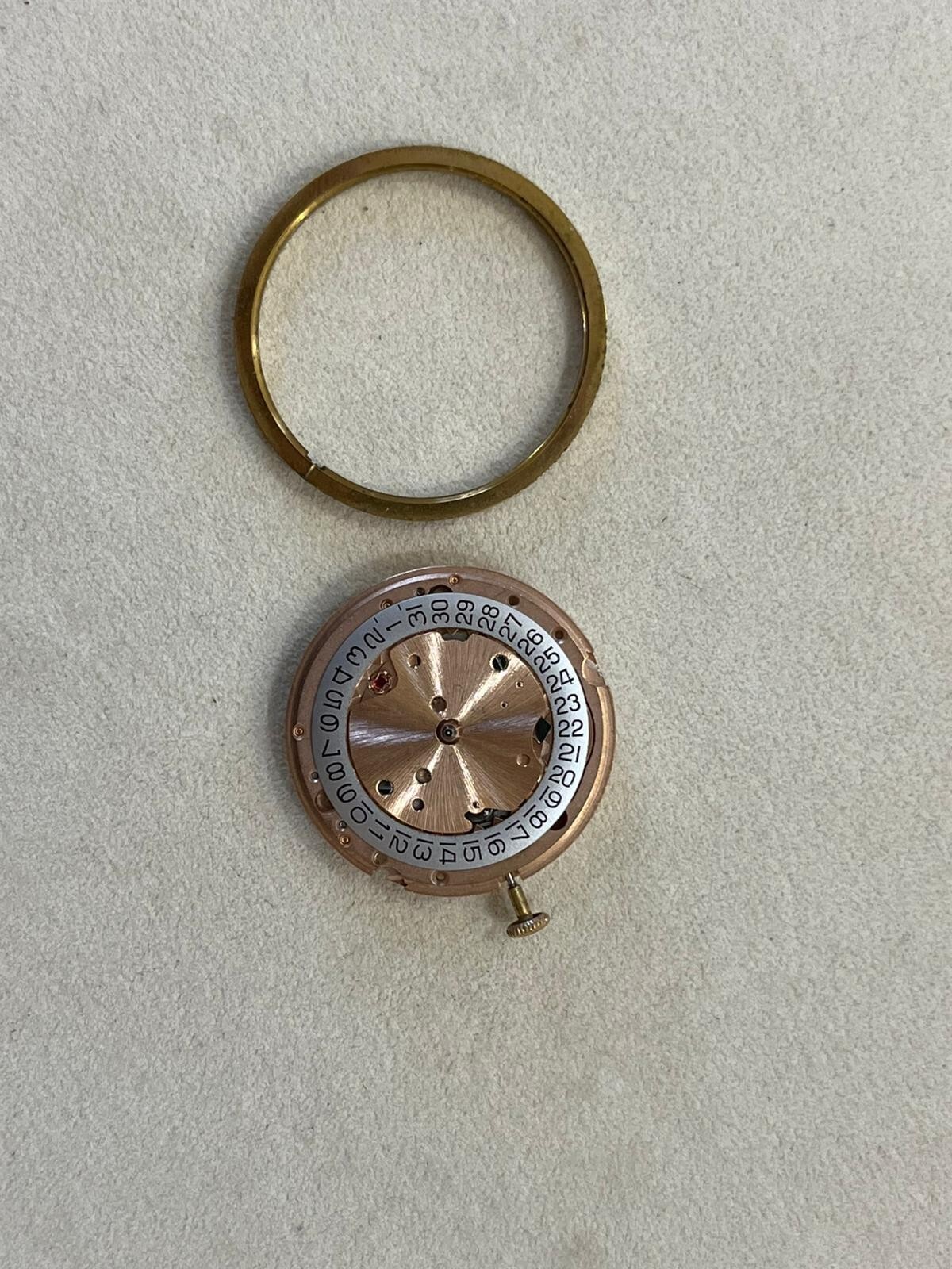 Omega movement with date, crown and brass back case, ref.25252995