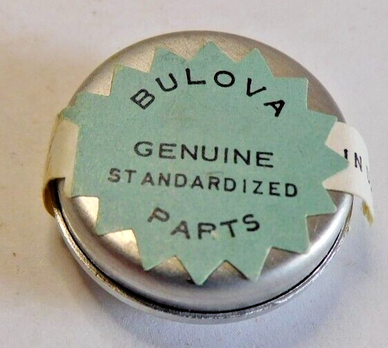 BULOVA 5 BD PART # 54 COMPLETE BALANCE WHEEL. OPEN PACKAGE. NEW OLD STOCK