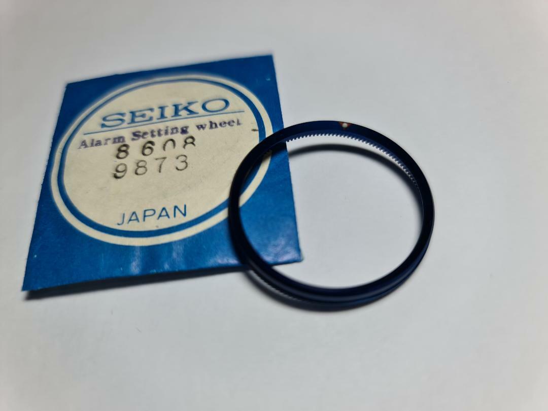 86089873 GENUINE BLUE ALRAM SETTING WHEEL SEIKO BELL-MATIC 4006-6050 6059 4006