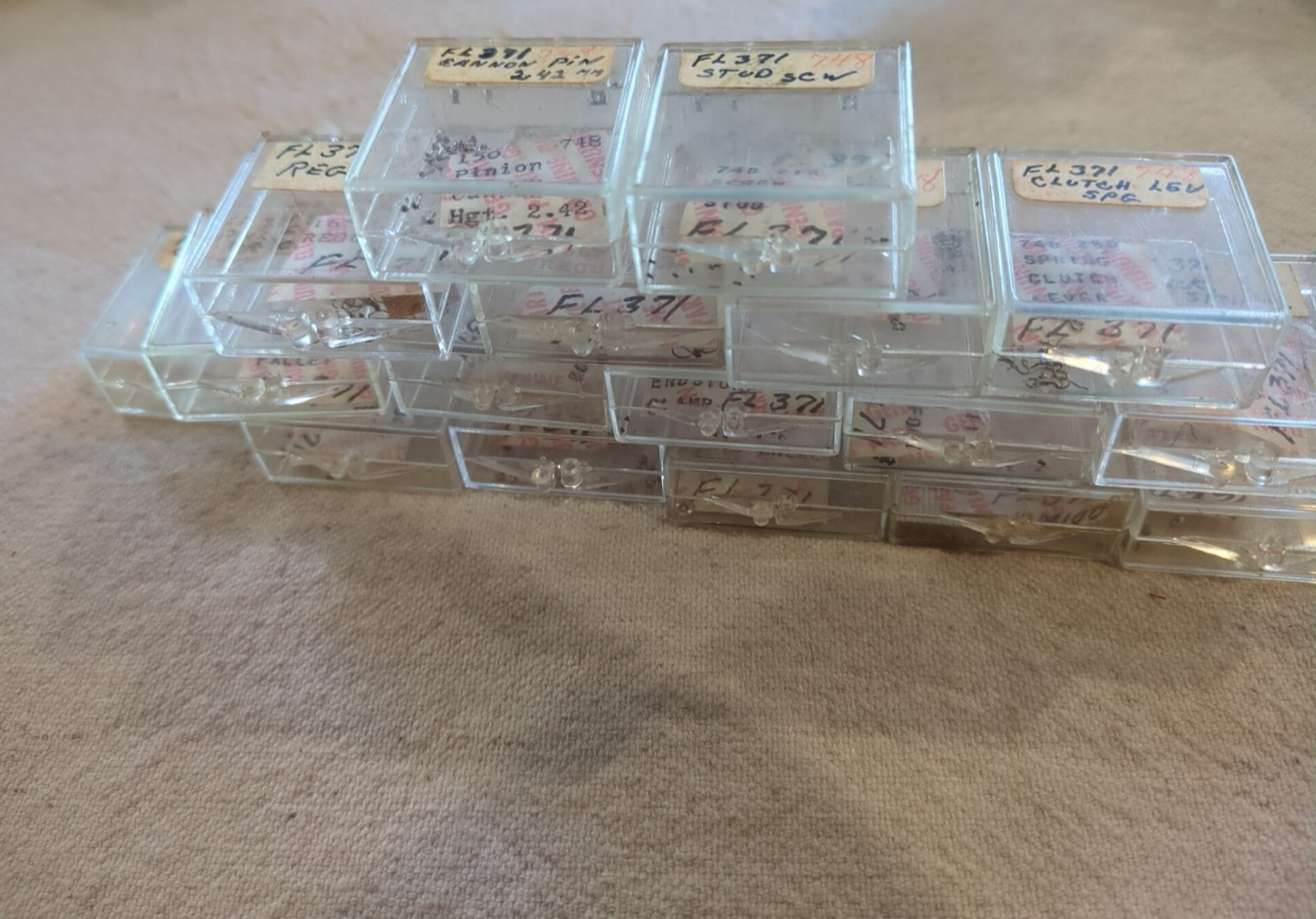 17 Boxes of Elgin 748 Movement Unused Jewels, Screws, Wheels, Regulators Etc…!