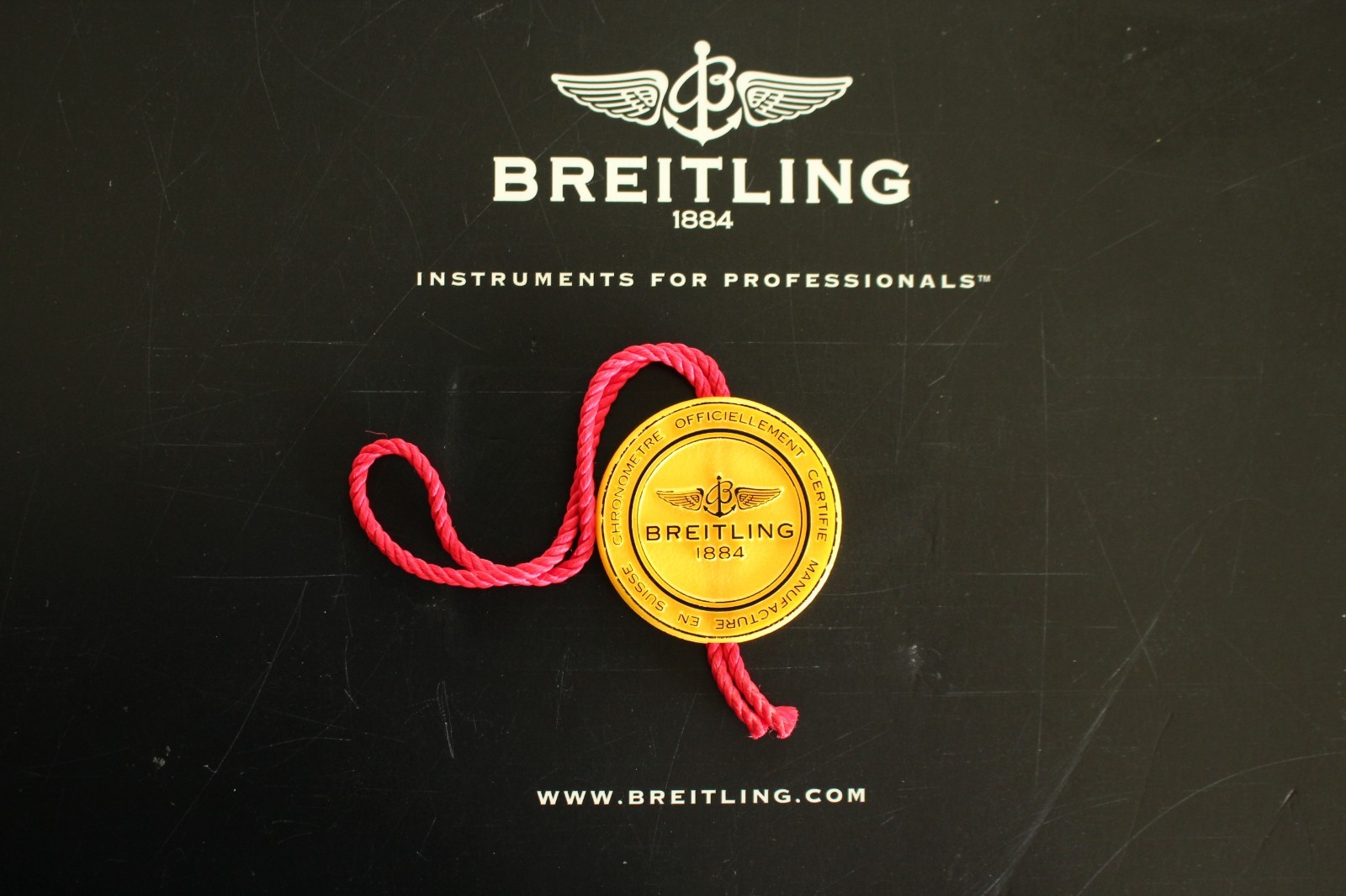 BREITLING FACTORY JEWELERS SALES ACCESSORY YELLOW PLASTIC WATCH HANG – SWING TAG