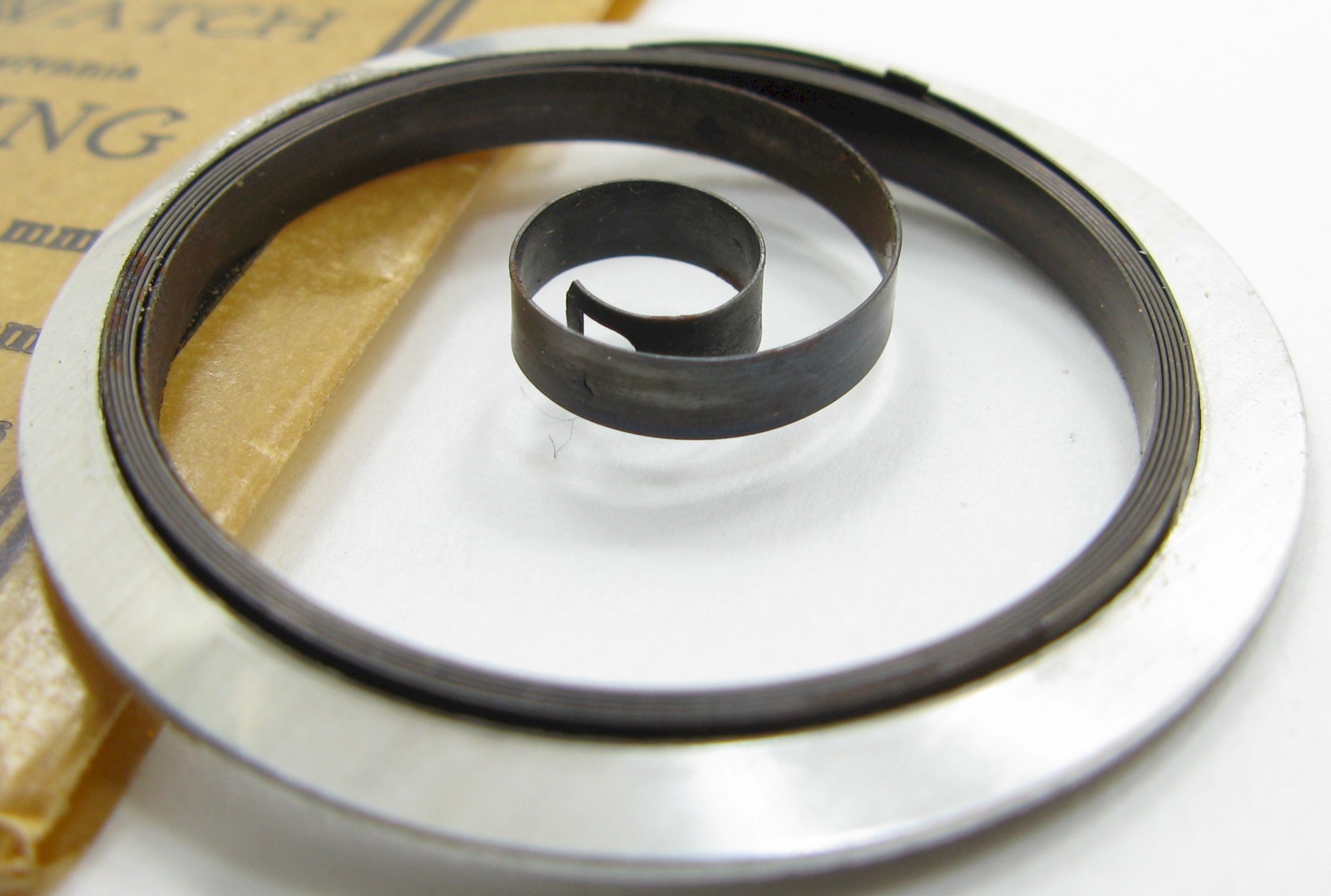 Illinois 16s M Bbl. 47327 T end Watch part: Mainspring x1 brown – blue alloy