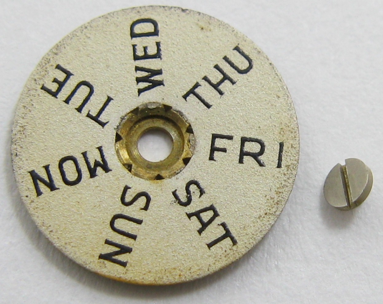 Venus 203 watch movement part: day disc & screw