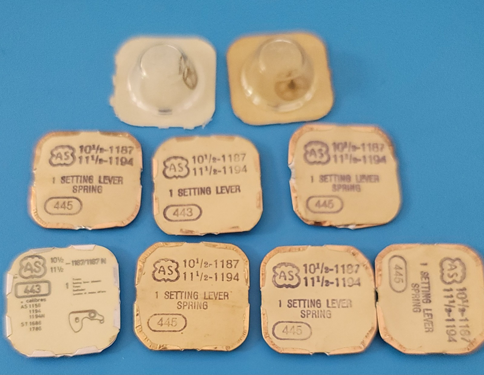 SB2-010: Lot of NOS Watch Parts AS 1187/1194 – Levers, Springs, Staffs, Gears