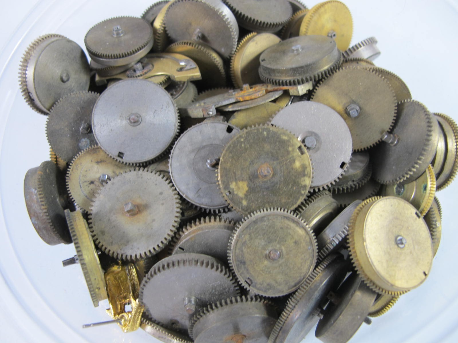 ANTIQUE GROUP OF MAINSPRING BARRELS AND BRIDGES FOR OLD POCKET WATCHES 89 PIECES