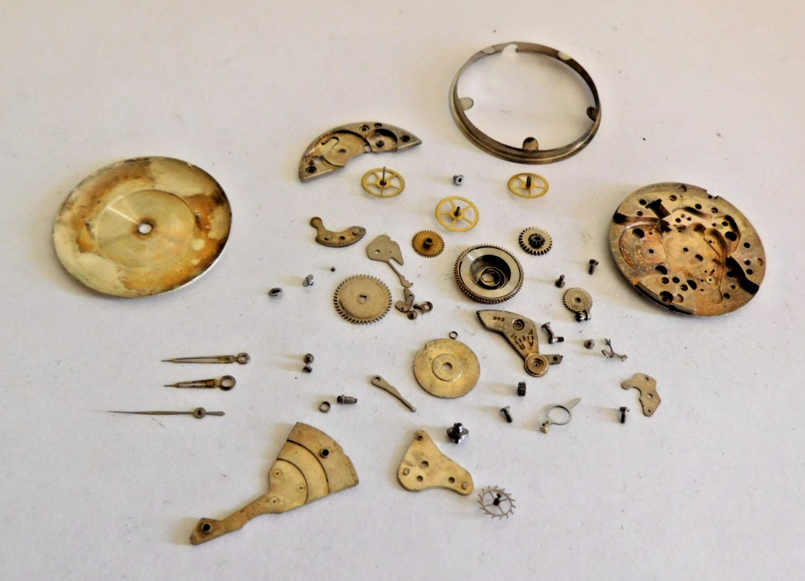 VENUS 5240 LOWER PLATE + PARTS WITH DIAL & MOVEMENT HOLDER. USED