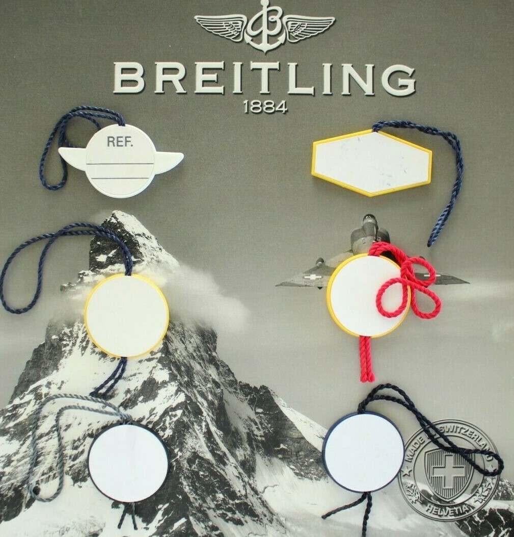 BREITLING FACTORY JEWELER’S BLACK PLASTIC WATCH HANG / SWING TAG THREE PIECE LOT