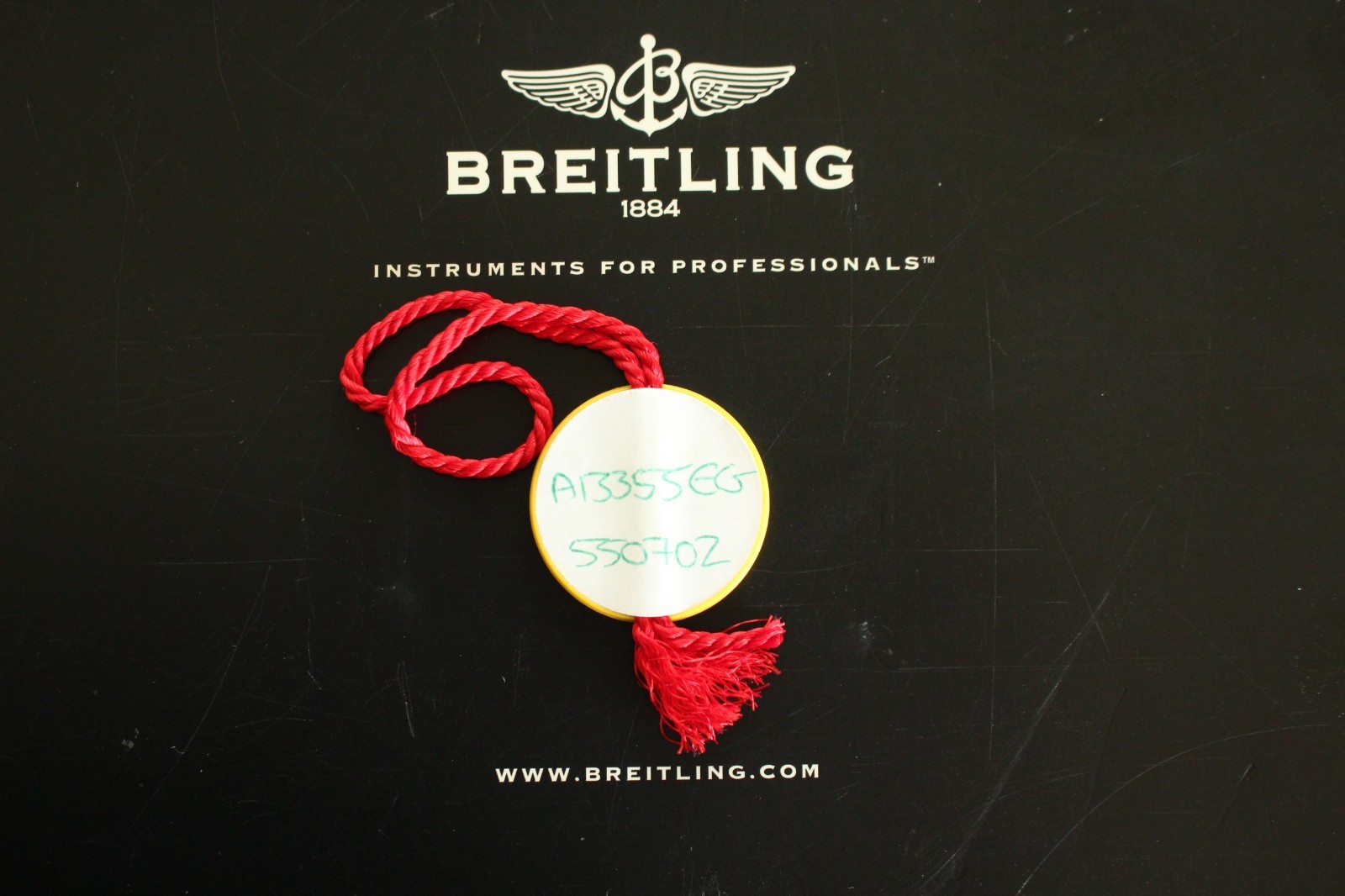 BREITLING FACTORY JEWELERS SALES ACCESSORY YELLOW PLASTIC WATCH HANG – SWING TAG