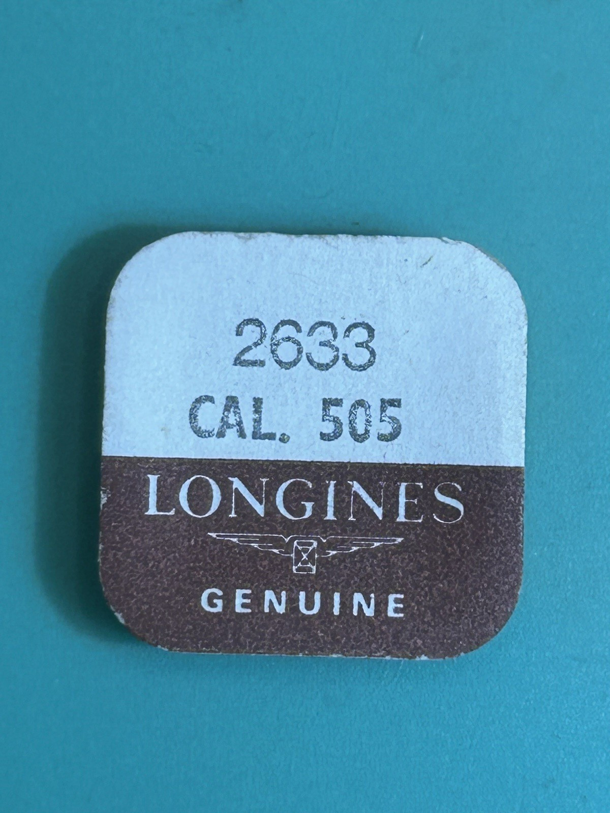 Longines Cal. 505 – Unlocking Yoke (Lever) Spring -2633- Orig. Part and Package