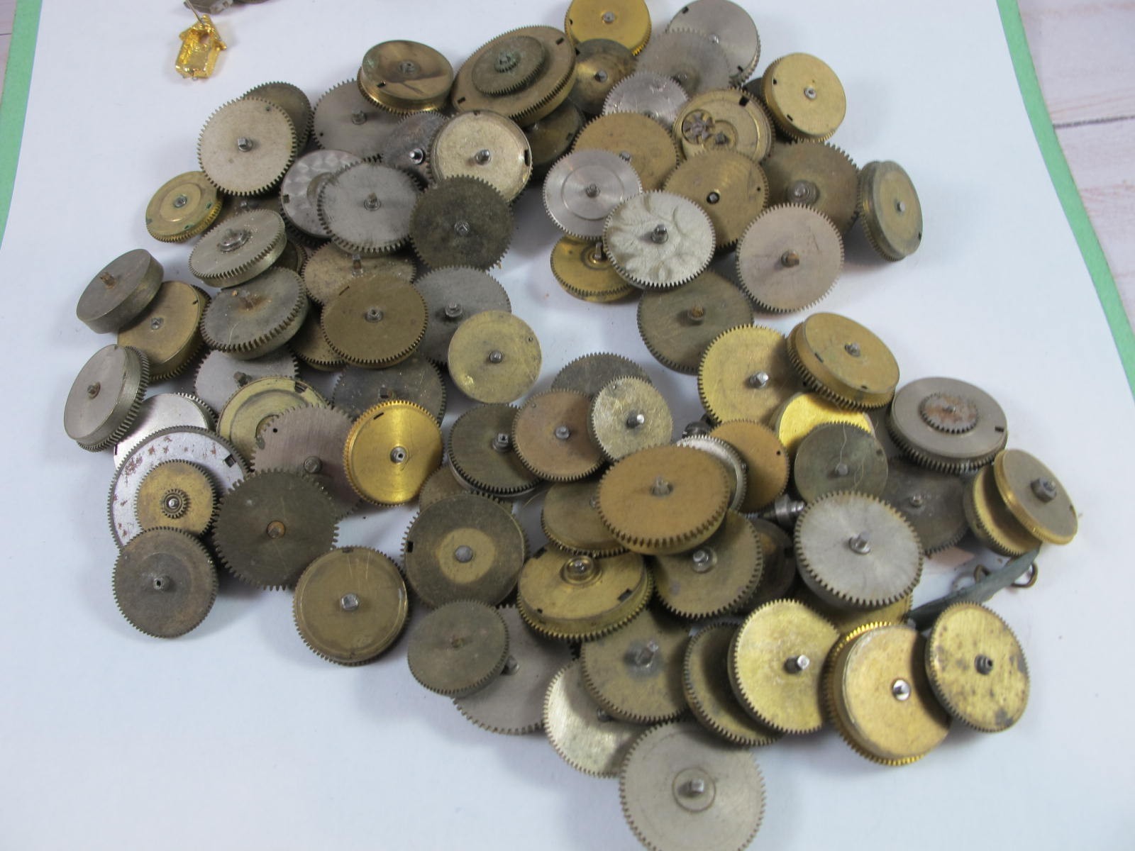 ANTIQUE GROUP OF MAINSPRING BARRELS AND BRIDGES FOR OLD POCKET WATCHES 89 PIECES