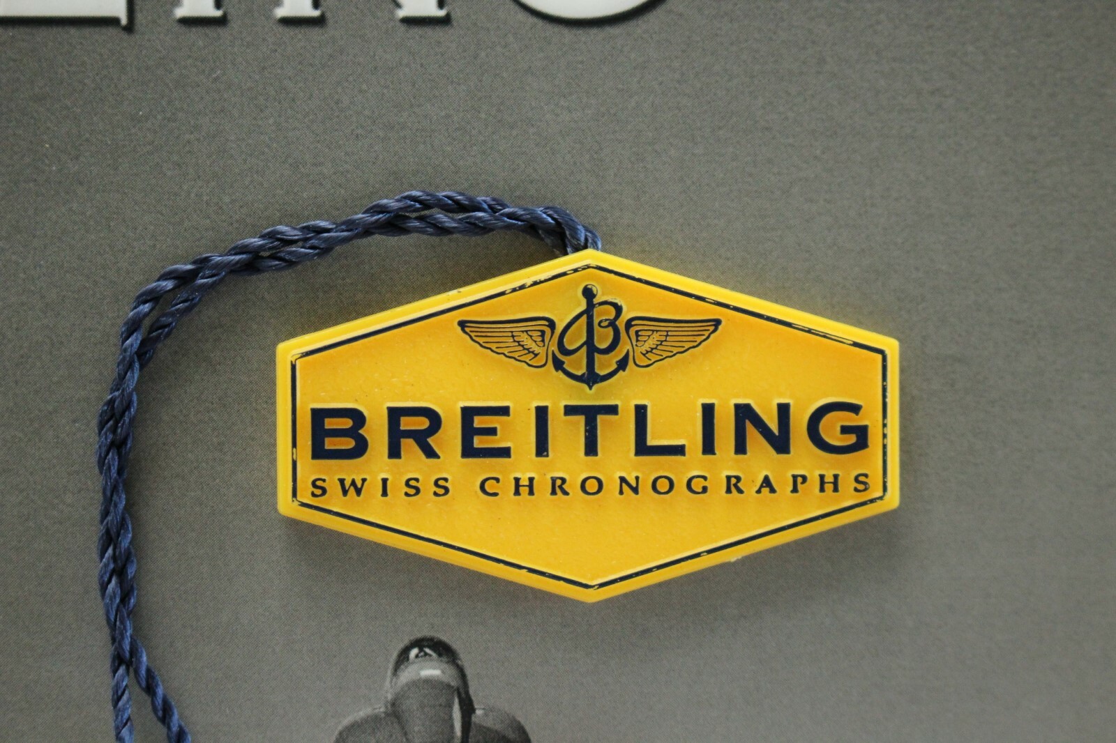 BREITLING FACTORY JEWELERS SALES ACCESSORY YELLOW PLASTIC WATCH HANG / SWING TAG