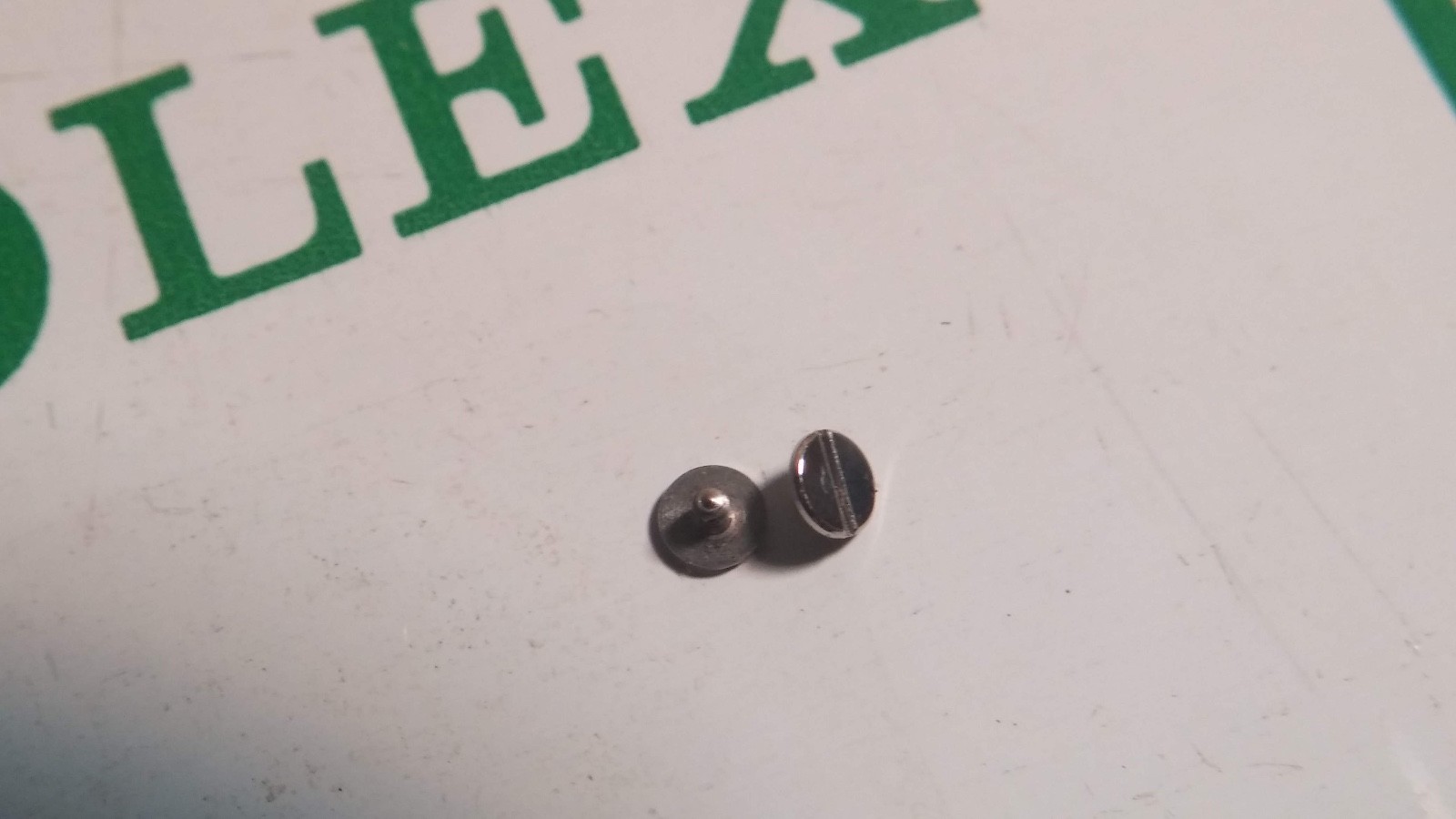 Genuine Rolex 1225 Bridle screw, approx 1.3mm total length, approx 2.3mm head di