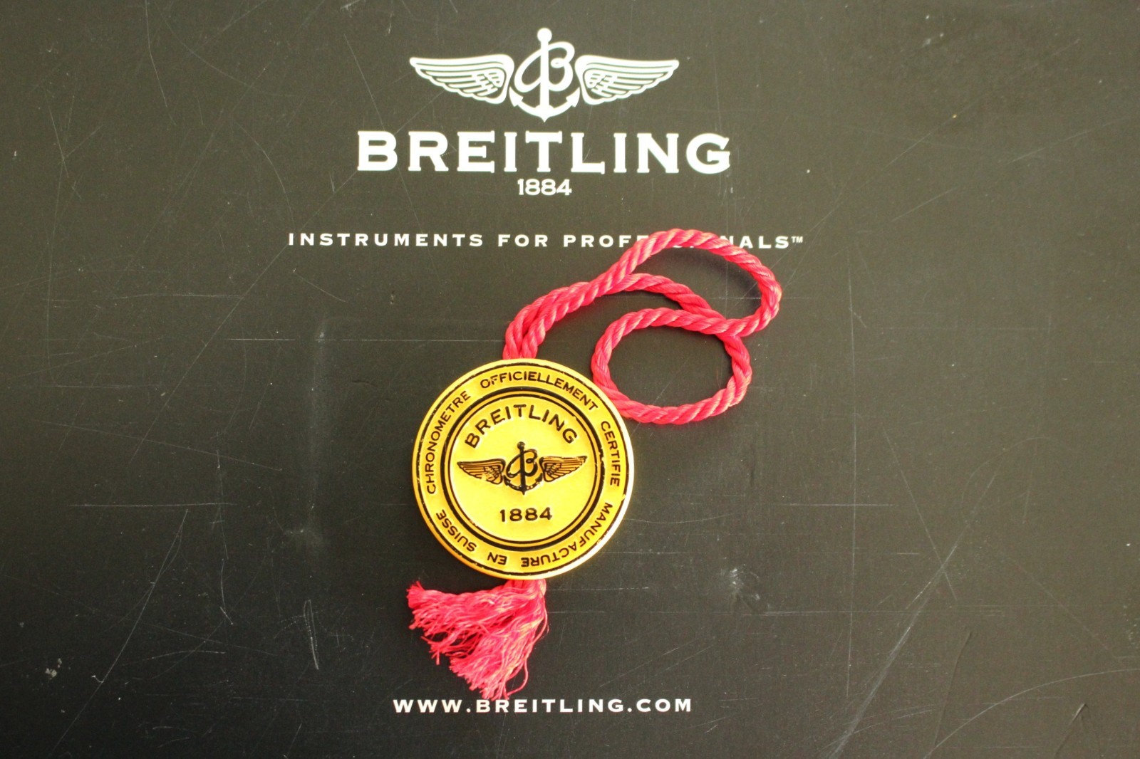 BREITLING FACTORY JEWELERS SALES ACCESSORY YELLOW PLASTIC WATCH HANG – SWING TAG