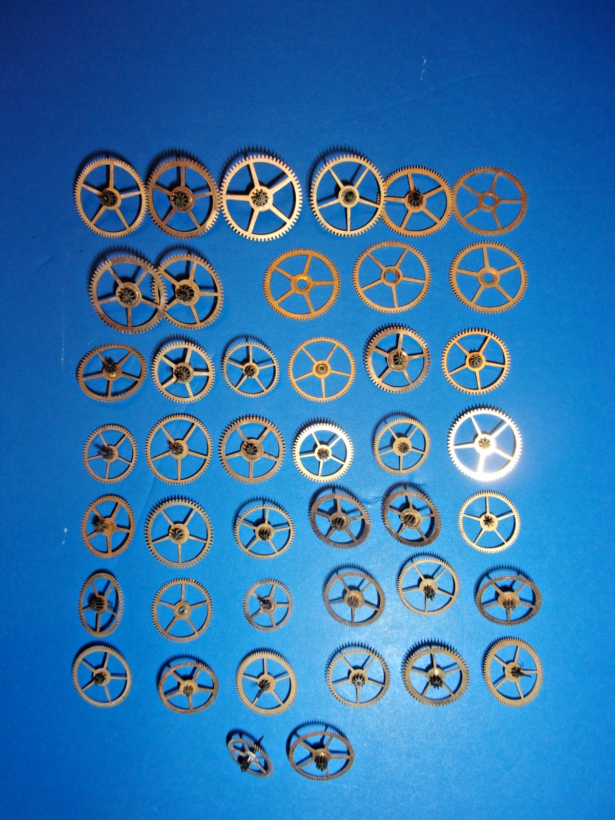 Elgin Pocket Watch Parts, Mix of 3rd and 4th and other power Train Gears + Tin