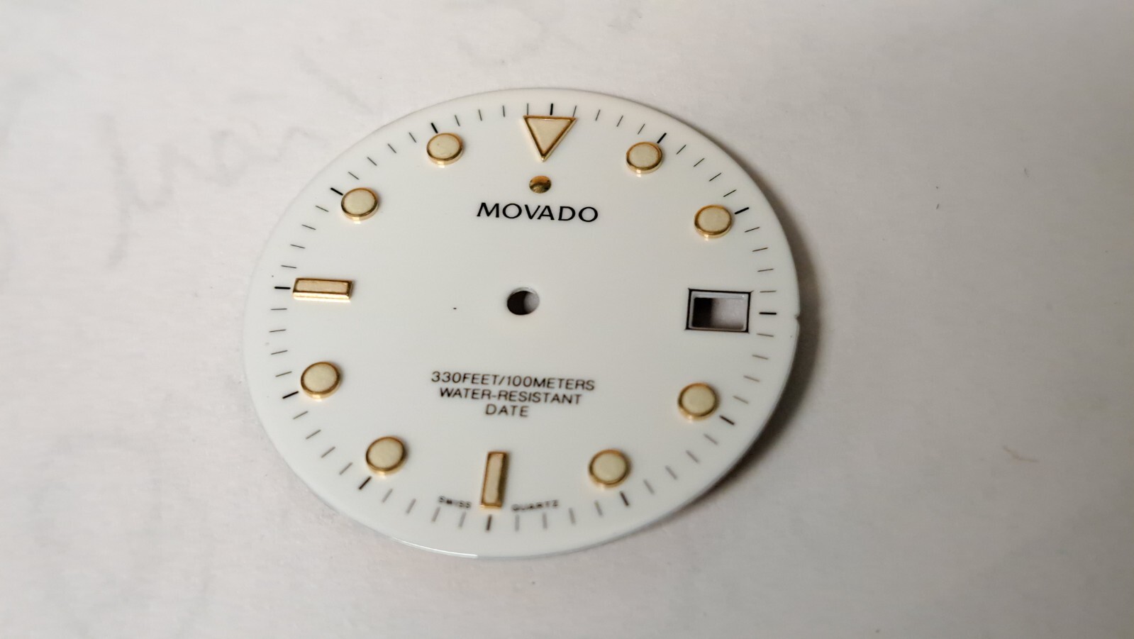 Movado DIAL white with green lume 28.9mm diameter. feet between2 and 3 o’clock a