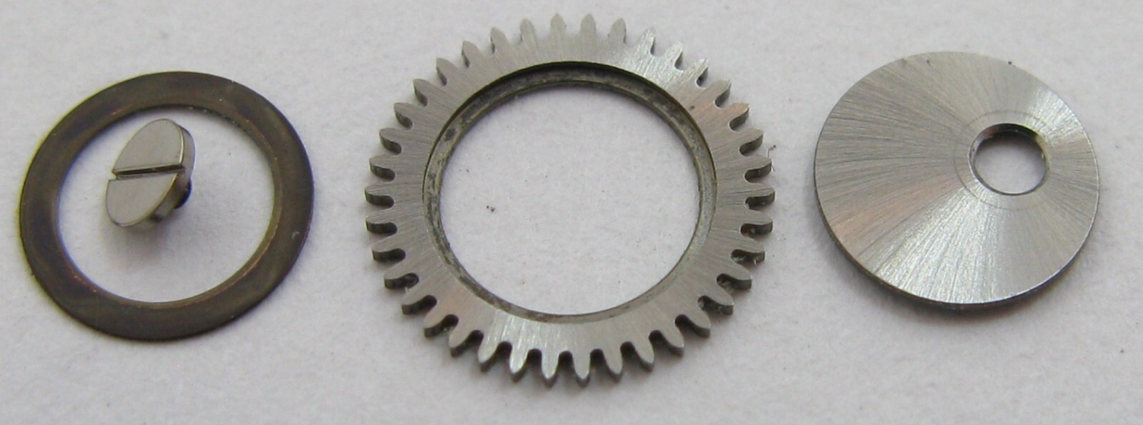 Omega 552 24 j. Watch movement part 1101 crown wheel + core & seat … 1102 1103