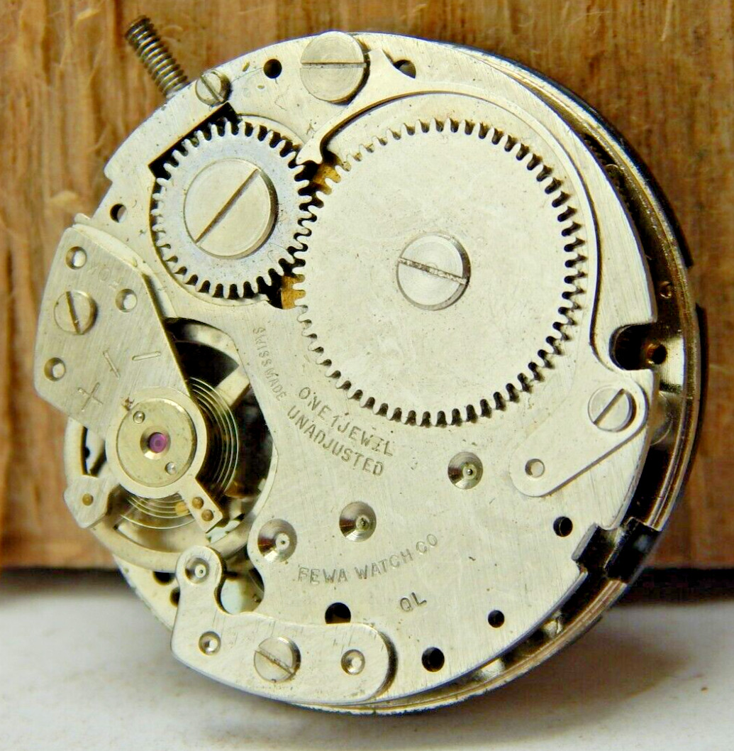 Vintage Fewa QL Lengr men’s wrist watch movement with black dial hands and stem