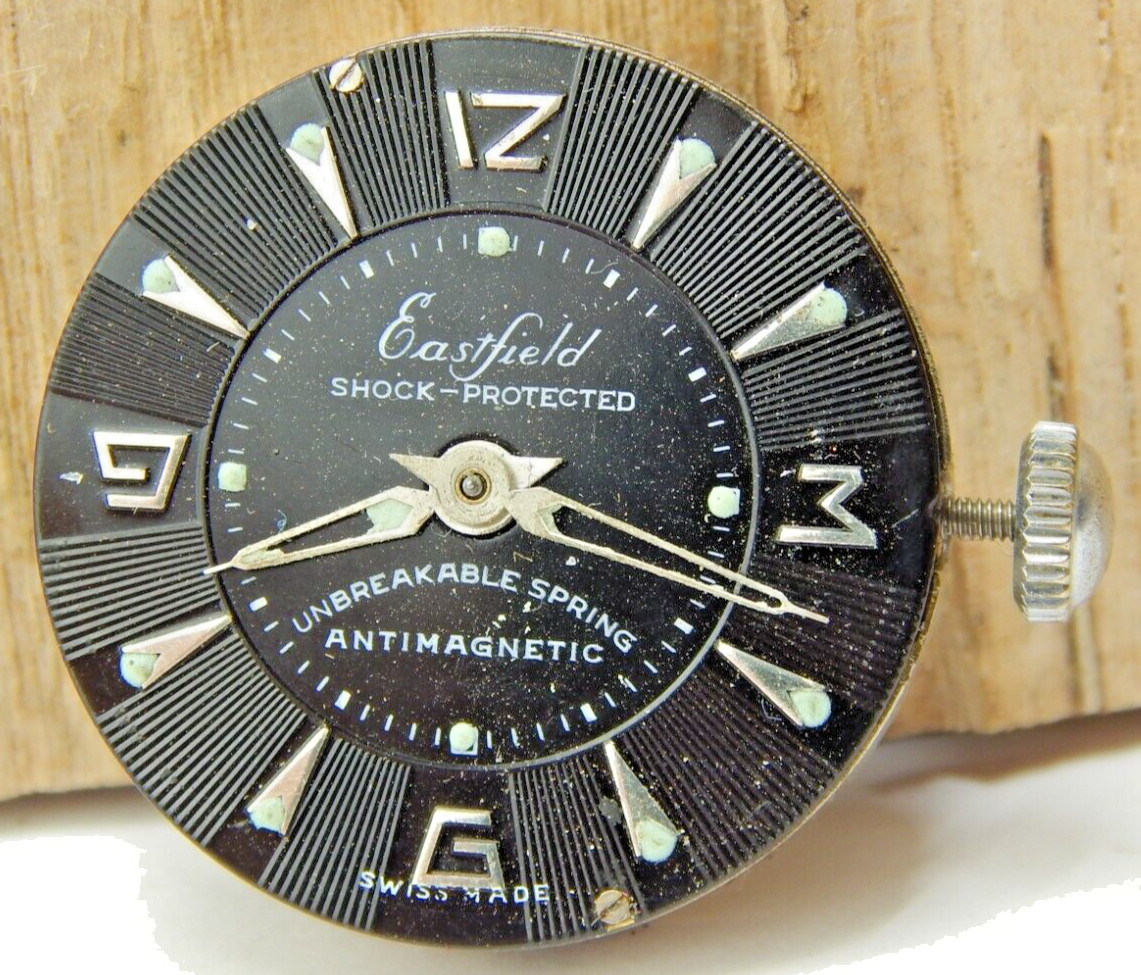 Vintage Eastern men’s wrist watch movement with black dial hands and crown combo