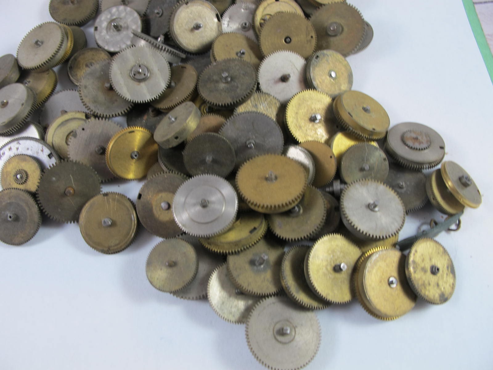 ANTIQUE GROUP OF MAINSPRING BARRELS AND BRIDGES FOR OLD POCKET WATCHES 89 PIECES
