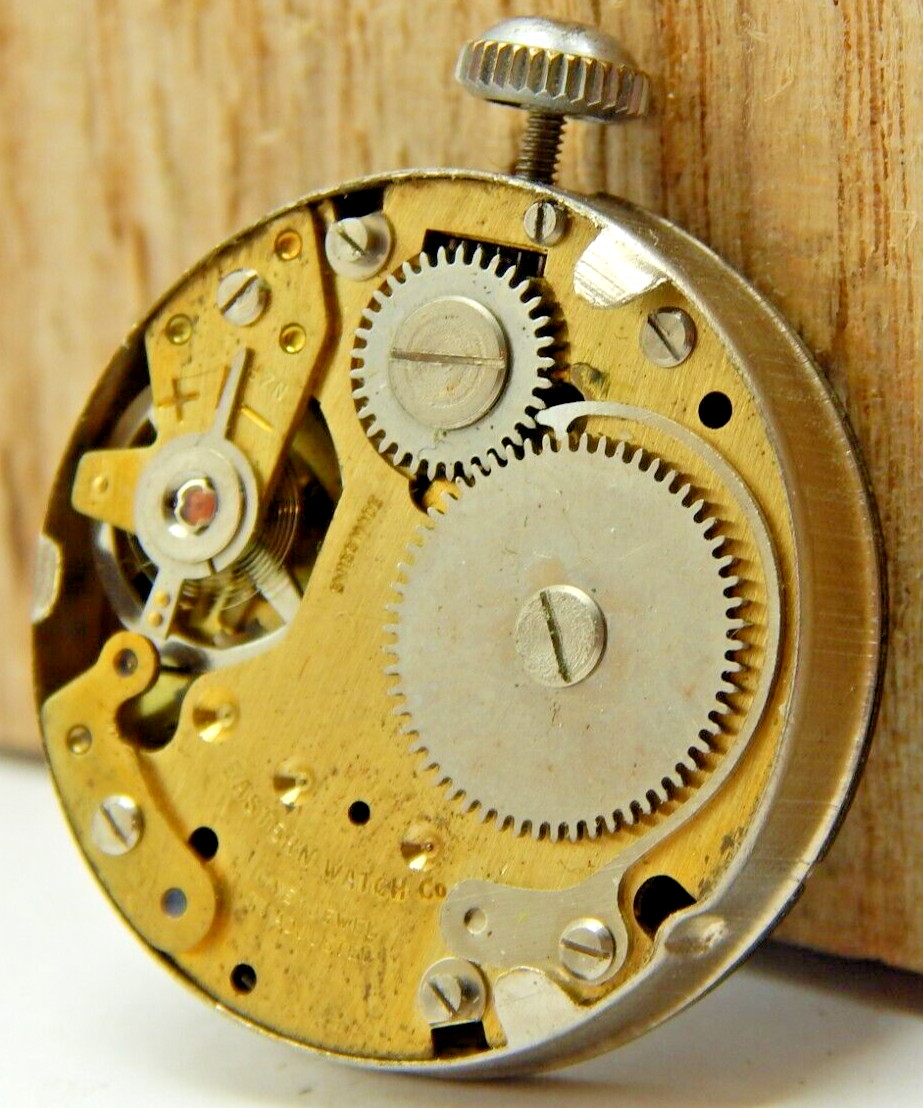 Vintage Eastern men’s wrist watch movement with black dial hands and crown combo