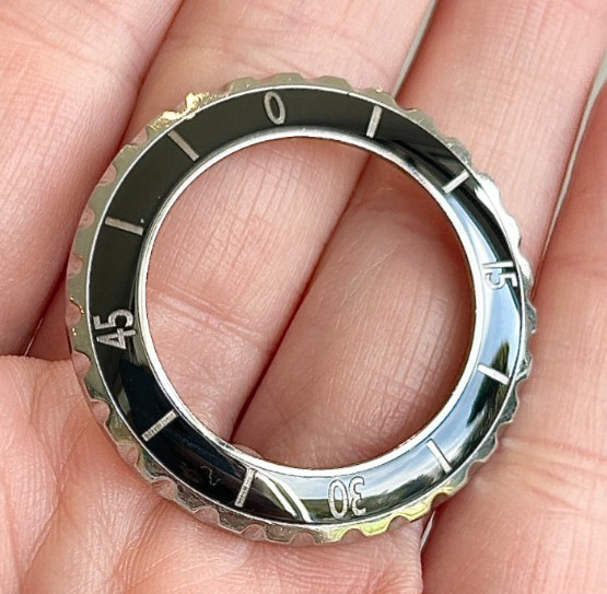 A Chanel J12 Black Ceramic Wristwatch Bezel for midsize model.