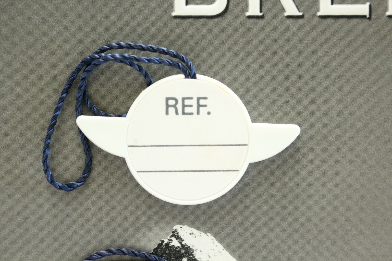 BREITLING FACTORY JEWELERS SALES ACCESSORY WHITE PLASTIC WATCH HANG / SWING TAG