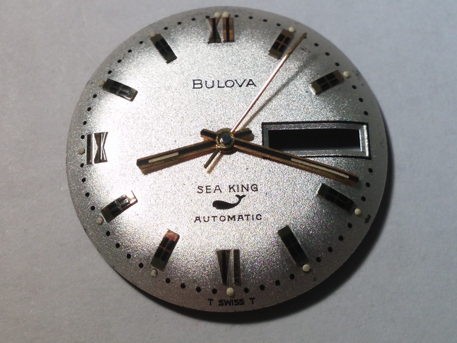 Bulova dial and 3 hands sea king silver and yellow, day/date Swiss made